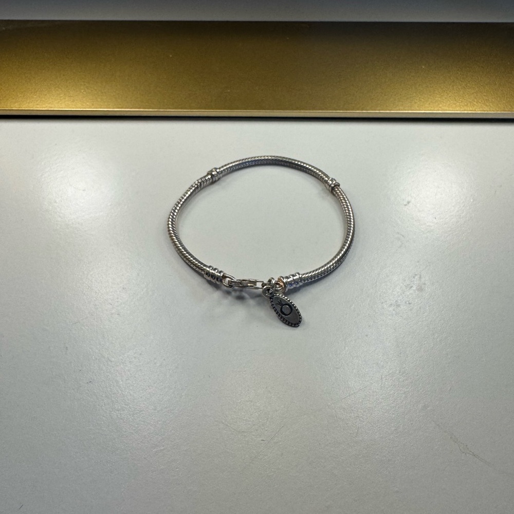 Elegant Pandora Silver Bracelet with Charms Sold Separately